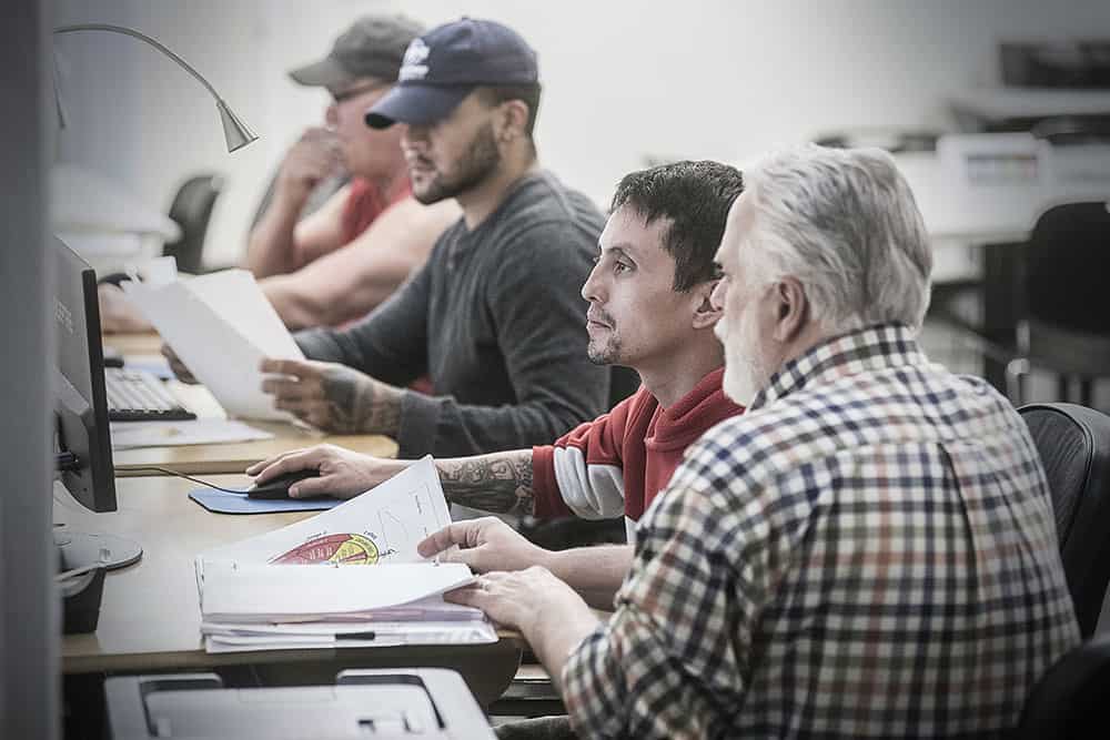 men working on computers